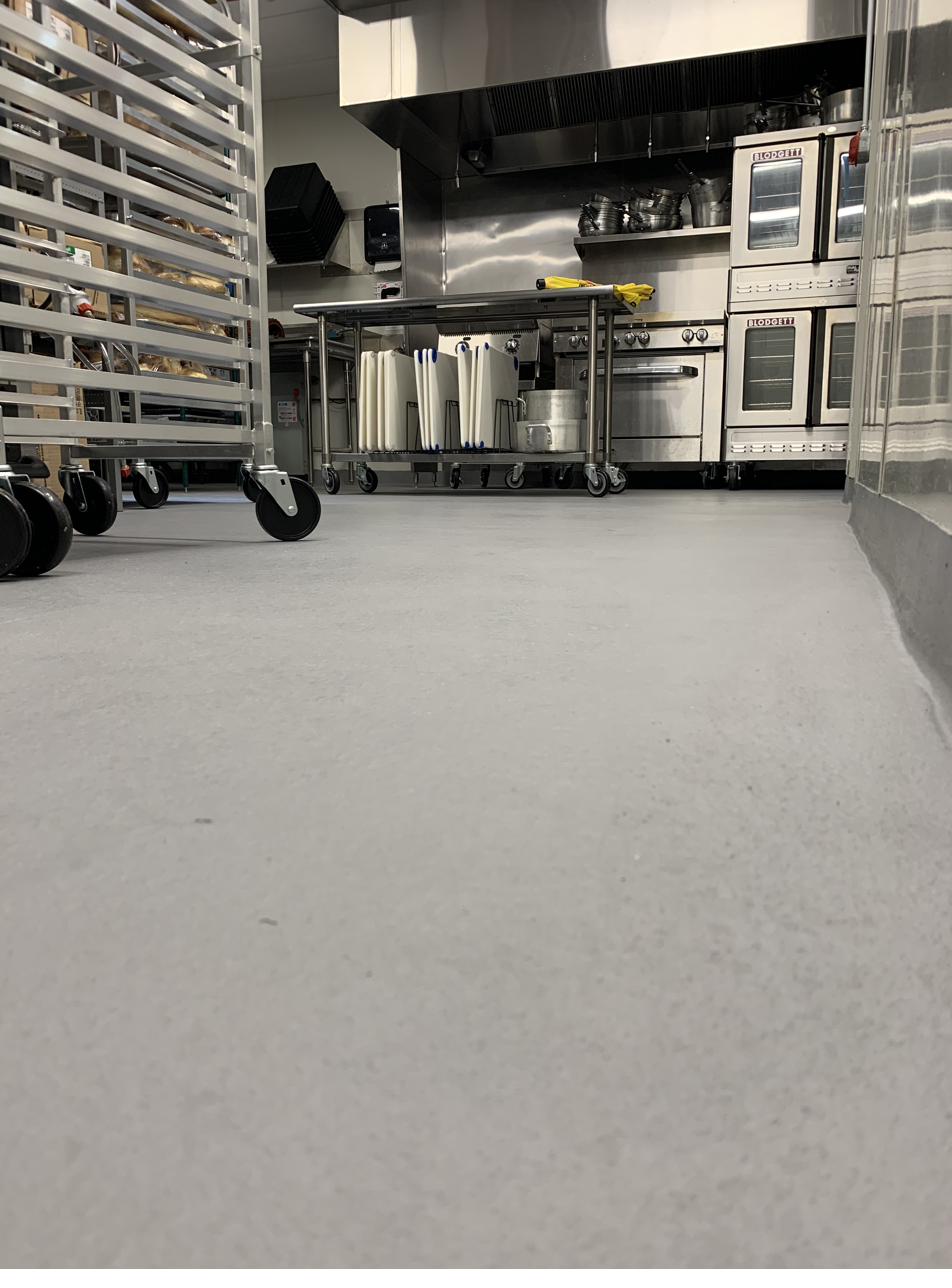 Grey slip resistant epoxy floor in a Wisconsin bakery prep kitchen