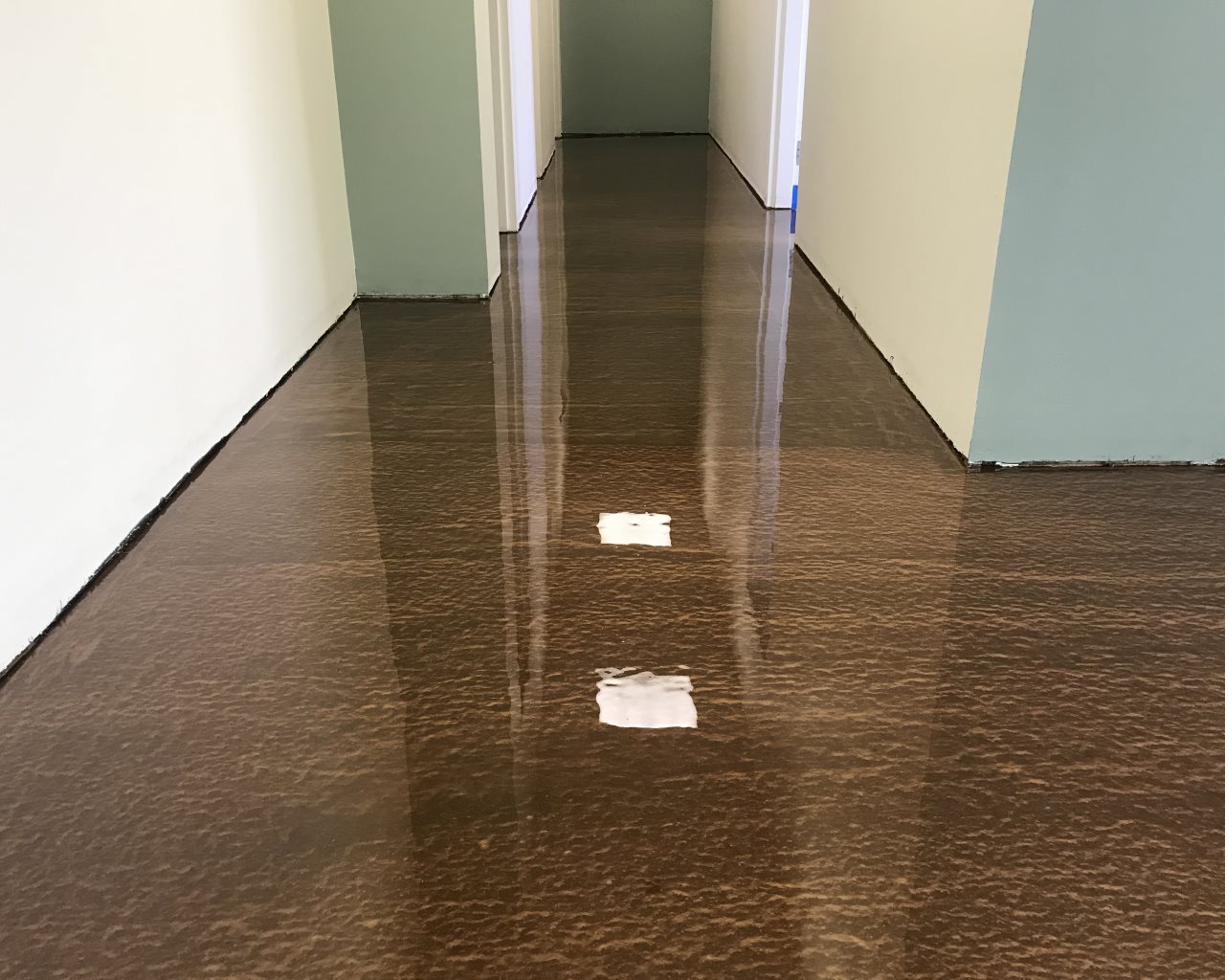Bronze marbled metallic epoxy floor in a Wisconsin office hallway